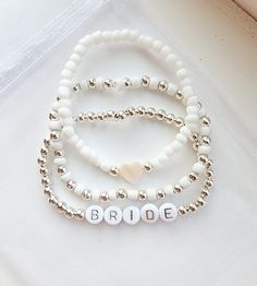 Beaded Name Bracelet-bride Bracelet-bridal Jewelry-bridal Shower Gift-gift for Bride-bracelets for Women - Etsy Wedding Clay Bead Bracelets, Bridal Shower Friendship Bracelets, Bride Bracelet Stack, Diy Wedding Bracelets, Bride Bracelet Ideas, Wedding Bracelets For Bridesmaids, Wedding Beaded Bracelets, Wedding Bracelets For Bride, Diy Gifts For Bride