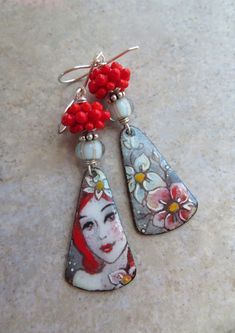 the earrings are decorated with flowers and beads