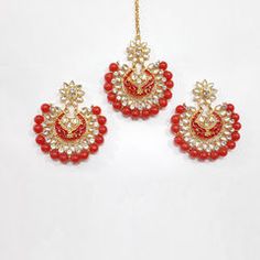 three pairs of red and white beaded earrings