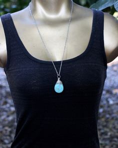 "I absolutely love these long turquoise blue magnesite necklaces! They are all so richly blue with beautiful earth-toned matrices. I wrapped them interestingly in silver filled wire with a patina to darken the recesses. They dangle on longs stainless steel chain. Wear them solo or layer them with other long boho necklaces! They will be your new favorite! Give even the simplest t-shirt and jeans outfit a bohemian flare with a pop of beautiful blue. - Turquoise magnesite teardrop pendants measure Blue Teardrop Wire-wrapped Necklace, Turquoise Wire Wrapped Crystal Necklaces For Gift, Turquoise Necklace As Gift, Turquoise Wire Wrapped Crystal Necklace For Gift, Wire Wrapped Turquoise Crystal Necklaces As Gift, Turquoise Teardrop Amazonite Jewelry, Turquoise Amazonite Necklace As A Gift, Turquoise Amazonite Necklace Gift, Gift Turquoise Amazonite Necklace