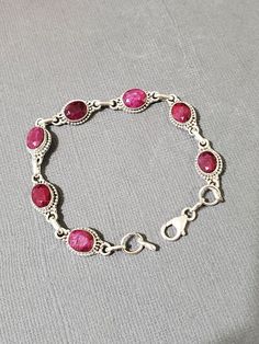 *7 1/4 Inches Ruby link bracelet  *Sterling Silver  *Free Shipping  *Handcrafted  *Jewelry ship in Gift box  All components are solid .925 silver.  Thank You For Your Looking ,And Check Out More Items In My Etsy Shop For More Great Deals, Also We Add More Jewelry To Etsy Shop regularly  www.etsy.com/shop/Silverlizzard  PLEASE check their dimensions, before setting the order.  NOTE -Once the parcel gets shipped out, it is usually needed 3-6 business days for every where in US Please keep in mind Sterling Silver Spiritual Bracelet For Anniversary, Spiritual Sterling Silver Bracelet For Anniversary, Sterling Silver Oval Chain Bracelet Gift, Engraved Oval Sterling Silver Bracelets, Engraved Sterling Silver Oval Bracelet, Engraved Oval Sterling Silver Bracelet, Silver Gemstone Chain Bracelet Gift, Sterling Silver Bracelet For Jewelry Making, Oval Sterling Silver Hallmarked Bracelets