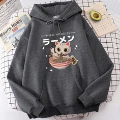 Harajuku Ramen Cat Hoodie: Embrace Kawaii Comfort with Feline Flair Wrap yourself in the purr-fect blend of comfort and quirky style with our Harajuku Ramen Cat Hoodie. This cozy hoodie is not just an outfit; it's a fashion statement that combines the charm of a mischievous cat with the delicious allure of everyone's favorite comfort food – ramen. Key Features: Adorable Cat Design: The hoodie features an irresistibly cute cat eating a bowl of steaming ramen. The playful and vibrant design adds a Comfy Streetwear, Harajuku Street Style, Harajuku Street, Kawaii Harajuku, Baby Tees Y2k, Y2k Baby Tee, Cat Hoodie, Men's Wardrobe, Harajuku Fashion