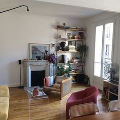 a living room filled with furniture and a fire place