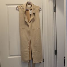 Brand New Never Worn Bought Off Vici . Company Idem Ditto . Faux Suede Tan Long Vest . No Sleeves No Buttons Has Pockets Lined Size Is Large Bust Is : 21 Inches Length Is : 39 Inches Beige Open Front Outerwear For Work, Beige Fitted Open Front Outerwear, Cream Open Front Outerwear For Work, Neutral Open Front Outerwear For Spring, Fitted Beige Outerwear For Casual Wear, Long Vest, Long Vests, Large Bust, Faux Suede