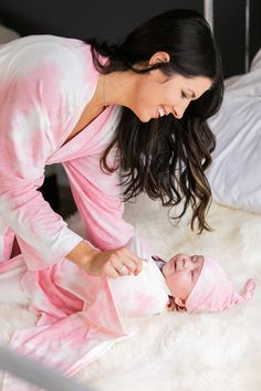 "Pink Tie Dye Maternity/Postpartum Robe, Baby Swaddle, Matching Hat & Bow MATERIAL: 95% Polyester 5% Spandex. A very soft and stretchy material. MEASUREMENTS: Maternity Robe - One Size Fit Most: > bust/waist/hip: 60 inches > robe length: 39 inches Swaddle: > 45 by 45 inches Knotted Hat: > fits newborn to 3/6 months Bow Headband: > fits newborn to - 3 years >>Due to the nature of this pattern (tie-dye), items will vary in design and may have slight color variance from the Pink Matching Sleepwear, Family Matching Pink Sleepwear, Pink Family Matching Sleepwear, White Nursing-friendly Sleepwear, Fitted Pink Onesie For Bedtime, Cute Pink Onesie For Mother's Day, Robe And Swaddle Set, Swaddle Sets, Baby Girl Shower Gifts