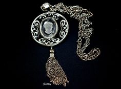 "Fabulous unsigned Whiting & Davis ornate Silver tone Vintage Retro Detailed silver tone metals and glass cameo pendant necklace. The pendant measures 2 5/8\" x 5 3/4\". The length of the chains is 25\" with the spring clasp.. We combine shipping, If you want to take advantage of the reduced shipping you must contact us before you pay for your items so we can send you a corrected invoice. Thank You for visiting our Etsy store https://www.etsy.com/shop/VictoryIssweet !" Vintage Glass Necklace Nickel Free, Cameo Pendant Necklace, Peacock Pendant, Filigree Pendant, Cameo Pendant, Glass Pendant Necklace, Vintage Gothic, 925 Sterling Silver Chain, Vintage Designer