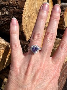 The purple cubic zirconia in this ring has a measurement of approx. 7.8mm x 7.5mm. The other cubic zirconias in this ring have a measurement of approx. 1.9mm. The back of shank has a measurement of approx. 3.4mm. This ring weighs approx. 4.7 grams. Size: 8 US. Stock number: 257 Cubic Zirconia Heart Cut Halo Ring For Promise, Heart-shaped Cubic Zirconia Ring With Prong Setting, Heart Shaped Cubic Zirconia Ring With Prong Setting, Purple Heart Cut Cubic Zirconia Jewelry, Purple Heart Ring With Accent Stones For Anniversary, Anniversary Purple Heart Ring With Accent Stones, Cubic Zirconia Heart Ring With Center Stone, Dazzling Cubic Zirconia Heart Ring With Brilliant Cut, Heart Cut Cubic Zirconia Ring With Halo Setting