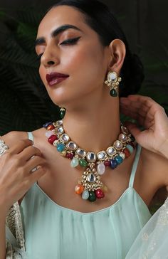 This navrattan necklace set with its pop of colors and quirky shapes is a sublime piece. The subtelty of the polki with hints of muted golden tones creates the perfect balance to create a winning look. Necklace Closure - Adjustable Dori Earrings Closure - Push Back Style Tip - This multicolored piece of art is perfect for gracing traditional funtions in full pomp and show. Navrattan itself being the traditional epitome of prosperity, wealth and status. What could be better than Handcrafted in Ja Multicolor Temple Jewelry Necklace As Gift, Multicolor Temple Jewelry Necklace For Gift, Festive Multicolor Kundan Necklace, Multicolor Temple Jewelry Necklaces For Gift, Traditional Colorful Jewelry For Festivals, Festive Multicolor Jewelry Sets For Celebration, Festive Multicolor Jewelry Sets As Gifts, Festive Multicolor Jewelry Sets Gift, Multicolor Traditional Kundan Necklace For Party