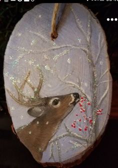 a deer ornament hanging from a tree