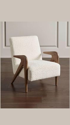 a white chair sitting on top of a hard wood floor