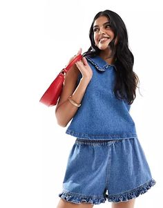 ASOS DESIGN denim frill collar tank top in mid blue | ASOS Sleeveless Denim Blue Top For Day Out, Casual Denim Blue Tops With Ruffles, Casual Denim Blue Ruffled Tops, Medium Wash Sleeveless Top For Day Out, Sleeveless Medium Wash Top For Day Out, Casual Blue Tops With Ruffled Collar, Casual Blue Top With Ruffled Collar, Summer Denim Tops With Ruffles, Trendy Denim Tops With Ruffles