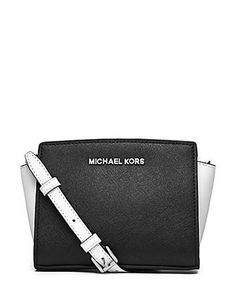 MICHAEL Michael Kors creates this must have petite sized crossbody in colorblocked saffiano leather. Top zip closure; inside slip pocket; removable adjustable shoulder strap. Approx. 8.5(L) x 5.5(H) x 3(D)"; approx. 25" drop. Color: Optic White / Black. Cheap Michael Kors Bags, Mini Messenger Bag, Favorite Purse, Michael Kors Selma, Cheap Michael Kors, Michael Kors Outlet, Beautiful Handbags, Purse Organization, Leather Messenger Bag