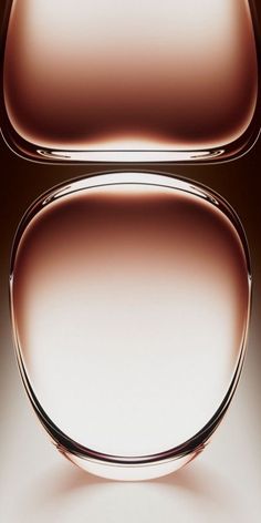 an abstract image of some kind of object in brown and white colors with light reflecting on the surface