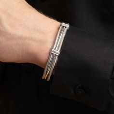 Our Maschio Men's Cuff Bracelets are masculine but luxurious with fine details. Choose from various options, each with different features. This bangle is larger in size and is standard length to fit most men's wrists. Made in Italy. Category: BraceletMetal: Sterling SilverStones: Choice of Black or White Diamonds (both 0.05 ct)Closure: Open CuffCollection: Men's Jewelry Fits average men's wrist sizes of about 8 inches. Luxury White Gold Cuff Bracelet Jubilee Style, Luxury White Gold Jubilee Cuff Bracelet, Classic Cuff Bracelets With Polished Finish, Polished Finish Cuff Bracelets For Formal Occasions, Timeless Silver Cuff Bangle, Luxury Polished Cuff Bracelet, Designer Bangle Cuff Bracelet, Adjustable Luxury Sterling Silver Bracelet, Luxury Adjustable Sterling Silver Bracelet