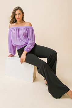 A solid woven top featuring accordion pleats, and elasticized off-the-shoulder neckline, long bishop sleeves, and a wide smocked waistband. Details Self: 100% polyester Size & Fit - Model is 5`8" and wearing size Small - Measurements taken from size Small - Length: 15" Chic Non-stretch Fall Blouse, Non-stretch Blouse For Night Out, Non-stretch Solid Blouse For Night Out, Solid Non-stretch Blouse For Night Out, Chic Non-stretch Party Top, Stretch Solid Blouse For Night Out, Stretch Solid Color Blouse For Night Out, Chic Purple Tops For Evening, Chic Purple Evening Tops