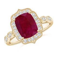 a gold ring with an oval shaped ruby stone surrounded by small white diamonds on the band