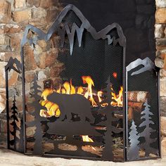 an outdoor fireplace with logs and fire in it