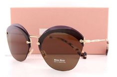 Miu Miu Sunglasses       Description   Guaranteed 100% Authentic Miu Miu Sunglasses. Condition: Brand New. Made in Italy.  Model Number: MU 53SS        Color: VX2 9L1 (Transparent Violet FRAMES; Brown LENSES) Sunglasses come with original Miu Miu paper box, hard case, cleaning cloth, and authenticity card. Size (mm):   Eye | Bridge | Vertical(B) | Temple |   | | |     62 | 16 | 53 | 140 |                  SHIPPING & GENARAL INFORMATION We take PayPal only. Free Priority Mail shipping within the Chic Brown Rimless Sunglasses, Miu Miu Casual Sunglasses With Gradient Lenses, Brown Rimless Sunglasses With Tinted Lenses, Casual Miu Miu Sunglasses With Gradient Lenses, Brown Rimless Tinted Sunglasses, Brown Rimless Polarized Sunglasses, Brown Rimless Sunglasses With Gradient Lenses, Brown Rimless Sunglasses With Mirrored Lenses, Brown Gradient Rimless Sunglasses