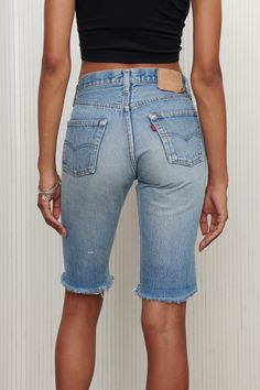 Softened long cut off denim shorts made from the most perfect fitting Levi’ 501 Jeans. Channel your inner Kendall Jenner in these shorts and get ready for summer! Features frayed hem and faded medium wash. 100% Cotton. Listed size 29. Fits like 27/28- Waist: 28" - Hips: 36" - Length: 20.5" - Inseam: 12" Summer Medium Wash Mid-thigh Jean Shorts, Medium Wash Jean Shorts With Frayed Hem, High Rise Medium Wash Bermuda Shorts With Frayed Hem, Light Wash Bermuda Shorts With Frayed Hem For Spring, Faded Cutoff Bottoms With Frayed Hem, Medium Wash Shorts With Frayed Hem, Medium Wash Mid-thigh Jean Shorts For Spring, Spring Light Wash Bermuda Shorts With Frayed Hem, Medium Wash Mid-thigh Length Jean Shorts For Spring