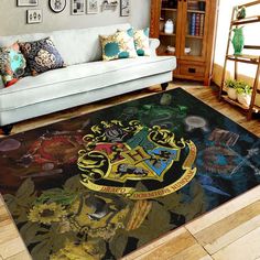 the hogwarts house rug is in front of a couch and bookshelf