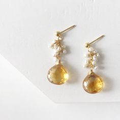 Cluster Citrine Earrings / Wire Wrapped Citrine and Pearls/ Dangle Ethnic Jewelry / Gold Tear Drop Bohemian Earrings / Gemstone EarringsThe earrings was crafted beautifully with citrine and pearls to match the tone. The details are sophisticated and wrapped with gold filled wire to make the piece lasts a long time. This stunning earrings are the must have addition to any jewelry box ♥Wire                         : Gold FilledLength of earrings: 1.80 inchesStone                       : Citrine an Handmade Citrine Dangle Earrings, Handmade Dangle Citrine Earrings, Gold Bohemian Earrings With Gemstone Accents, Elegant Yellow Earrings With Natural Stones, Handmade Teardrop Citrine Earrings, Citrine Dangle Earrings With Ear Wire, Handmade Citrine Teardrop Earrings, Citrine Drop Earrings For Wedding, Citrine Earrings With Gemstone Accents As Gift