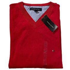 A Sleek Red V-Neck Sweater From Tommy Hilfiger: The Pristine Match For Pairing With A Collared Shirt. New With Tags. Men’s Tommy Hilfiger V-Neck Sweater New With Tags Nwt Color: Red Logo Appliqu At Left Chest Long Sleeves Ribbed Cuffs And Hem And V-Neck V-Neckline 100% Cotton (Approximate Measurements Laying Flat) Dimensions: (Pit To Pit) 24” Inches Dimensions: Cuff Opening 4” Inches Dimensions: (Length) 27 1/2” Inches *Comes From Smoke Free, Pet Free Home *Wear For: Office, Business Casual, Goi Classic Red V-neck Sweater, Tommy Hilfiger V-neck Winter Top, Tommy Hilfiger V-neck Tops, Red Cotton V-neck Sweater, Classic Red V-neck Sweater For Winter, Office Business Casual, Navy Blue Sweater, Tommy Hilfiger Sweater, Preppy Casual