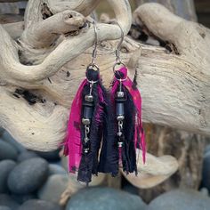 "These beautiful boho inspired earrings are hand-crafted using recycled sari silk and a variety of glass and seed beads.  They are very lightweight and the perfect addition for a casual day or fun night on the town Materials: Sari Silk/Glass Beads/Nickel Free Earwire Color: Black/Fuchsia Measurements: Drop length approx. 2 3/4\"/Tassel 2\" Weight : 1 gram/.07 oz. (individual earring) Designer: Norma Patridis *Each set of earrings comes boxed ready for gifting* Please note that color may slightly Handmade Tassel Earrings For Festivals, Handmade Unique Tassel Earrings For Festivals, Handmade Bohemian Tassel Earrings For Festivals, Pink Tassel Beaded Earrings For Beach, Bohemian Beaded Earrings With Latkans For Summer, Beach Earrings With Latkans, Pink Fringe Earrings For Festival, Bohemian Beaded Earrings With Latkans For Beach, Bohemian Pink Earrings With Latkans