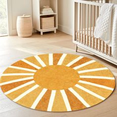 an orange and white rug in a baby's room next to a crib