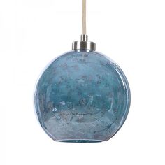 a blue glass ball hanging from a cord