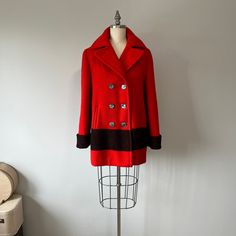 "A vibrant red vintage coat from the Hudson's Bay Company! It is not in perfect condition but is still in great shape. You can tell someone has worn it a bit. There is a bit of wear to the wool material and a few spots where the wool has been worn down but hardly noticeable. It's double breasted with 6 beautiful buttons running down the front of the coat. It even still has an extra button attached to the inside! There are two pockets and the lining is a black satin acetate.  Size: S/M Tag - Huds Blanket Jacket, Red Wool Coat, Winter Red, Hudson Bay, Coat Vintage, Festival Clothing, Womens Jackets, Red Vintage, 60s Fashion