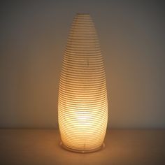 An illuminated simple LED torpedo-shaped paper lantern. Table Lanterns, Moon Table, Wire Armature, Paper Lampshade, Paper Table, Paper Moon, Lantern Lamp, Led Lantern, Washi Paper