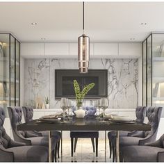 a dining room table with chairs and a television mounted to the wall above it, surrounded by glass shelves