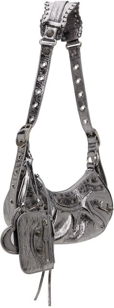 Crinkled Arena lambskin shoulder bag in metallic silver-tone. · Pin-buckle shoulder strap · Detachable zip pouch at shoulder strap · Detachable mirror · Studs and pin-buckle straps at face · Gathering at face · Zip closure · Cotton canvas lining · Antiqued silver-tone hardware · H5.5 x W10 x D2.5 in Supplier color: Silver Balenciaga Bag Strap, Balenciaga Shoulder Bag, Fancy Purses, Silver Bag, Silver Bags, Zip Pouch, Summer Style, Antique Silver, Metallic Silver