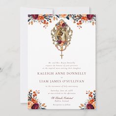 a wedding card with an ornate cross and flowers