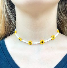 This beautiful Sunflower necklace is inspired by Harry Styles' song Sunflower vol. 6! I absolutely love the cute yellow sunflowers around the necklace. Similar to my other sunflower necklaces, this necklace is 14 inches long and has a two-inch extender chain and lobster claw clasp. This necklace is a perfect accessory to wear for any season, and is sure to bring you compliments! Yellow Adjustable Flower Pendant Necklace, Adjustable Yellow Flower Pendant Necklace, Adjustable Yellow Flower Necklace, White Flower Jewelry With Sunflower Design, White Flower-shaped Jewelry With Sunflower Design, White Sunflower Design Flower Jewelry, Yellow Beaded Flower Necklace As Gift, Yellow Flower Necklace With Colorful Beads As Gift, Yellow Beaded Flower Necklace Gift