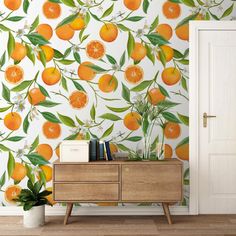 an orange tree wallpaper in a room with a dresser and bookcase next to it