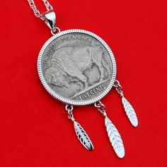 "You are looking at a gorgeous solid 925 sterling silver necklace, set with an United States 1937 Indian Head Buffalo Nickel 5-cent coin, showing REVERSE Buffalo in front. The pendant frame is made of solid 925 sterling silver with three feathers, about 1.77\" x 0.9\" overall dimension, and have never been used before. The coin is in great condition. I only use these coins with readable dates, never try to clean them, and always keep their collectible and numismatic values. I hope you end up wit Classic Coin Pendant Necklace For Commemoration, Classic Coin Jewelry For Commemoration, Classic Round Coin Pendant Jewelry, Commemorative White Gold Necklace With Coin Pendant, Sterling Silver Engraved Coin Jewelry, Engraved Sterling Silver Coin-shaped Jewelry, Classic Sterling Silver Necklace With Coin Pendant, Classic Coin Necklace With Polished Finish, Engraved Sterling Silver Coin Jewelry