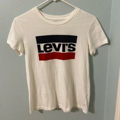 Vintage Levi's Logo T-Shirt Size : Small *Never Worn Make Best Offer! Levi's Short Sleeve T-shirt For Spring, Levi's Graphic Tee Crew Neck Top, Levi's Graphic Tee With Crew Neck, Levi's Basic Short Sleeve T-shirt, Levi's White Relaxed Fit Top, Casual White Levi's Top, Levi's Short Sleeve T-shirt With Letter Print, Levi's Logo Print Crew Neck Top, Levi's Short Sleeve Letter Print T-shirt