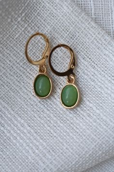 These Green Pendant Hoop Earrings include a green leaf like hue in the charms which adds a captivating touch. Color: Gold and Green. Material: Zinc Alloy. Measurements: Length: 3.0 Centimeters. Width: 1.0 Centimeters. Green Metal Clip-on Earrings, Green Metal Drop Clip-on Earrings, Green Metal Clip-on Earrings For Gift, Green Teardrop Metal Earrings, Trendy Green Dangle Hoop Earrings, Trendy Green Dangle Jewelry, Trendy Green Metal Jewelry, Green Teardrop Nickel Free Hoop Earrings, Nickel-free Green Teardrop Hoop Earrings