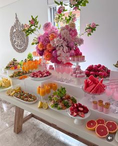 a table topped with lots of different types of food and drinks on it's sides