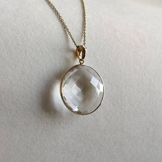 ITEM DESCRIPTION: >>The pendant is made from Solid 14K Yellow Gold. Gemstone used is absolutely natural and ethically sourced. >>Natural Clear quartz briolette in Round shape and bezel setting is studded on it with utmost precision. >>This is a minimalist design and is absolutely hassle-free and everyday jewelry. Gem: Clear quartz Gem size: 20 mm, round Gem weight: 14.58carats Gold purity: 14K (58.33% approx.) Gold weight: 0.61 grams Gross weight: 3.53 grams The Gold purity is guaranteed and it Refined 14k Gold Jewelry With Vs Clarity, Round Gold Gemstones Fine Jewelry, Faceted 14k Gold Round Jewelry, Modern Gemstones For Anniversary, Gold Round Gemstones For Anniversary, Modern Round Gemstones For Anniversary, Yellow Gold Briolette Gemstones For Formal Occasions, Refined Oval Jewelry Gift, Formal Yellow Gold Briolette Gemstones