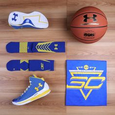 various sports items laid out on a wooden floor next to a basketball and socks,