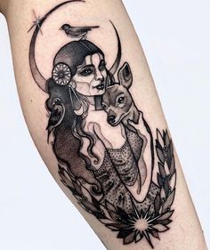 a woman with a bird on her shoulder and a wolf in the background, is depicted by this tattoo artist