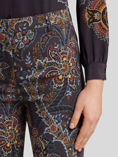 Flared stretch cady trousers with pressed creases. This high-waist model features a decorative floral Paisley print.• Slim fit • Regular-rise waist• Hook and zip closure• Rear welt pockets• Made in Italy• The model is 5’10” (178 cm) tall and wears a size 40 (IT) • 95% viscose, 5% elastane Poncho Jacket, Model Features, Suit Shirts, Best Wallet, Fragrance Collection, Lacing Sneakers, Espadrille Shoes, Tie And Pocket Square, Explore The World