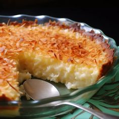 a close up of a pie on a plate with a spoon