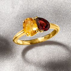 Ross-Simons - 1.10ct Citrine, .90ct Garnet Toi et Moi Ring Over Sterling. Size 9. French for "you and me," Toi et Moi rings are a unique way to celebrate a special relationship in your life. Wear our on-trend, two-stone designs as a sentimental symbol of romance, friendship, family - or simply treat yourself to double the sparkle! This fiery statement features a 1.10 carat oval citrine shimmering beside a .90 carat pear-shaped garnet. Crafted in polished 18kt yellow gold over sterling silver. 1/4" wide. Garnet and citrine two-stone ring. Garnet birthstones are the perfect gift for January birthdays. Birthstones By Month, Garnet Birthstone, January Birthday, Citrine Ring, Stone Design, Birthstone Ring, Stone Ring, Pear Shaped, Stone Rings