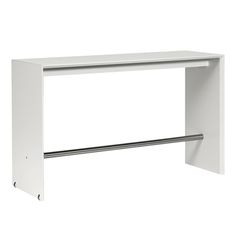 a white desk with a metal handle on the top and an open shelf above it