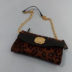 Monet Leather Clutch Removable Chain Strap Leopard Print Black/Brown. Measures Approximately 6" High X 9.5" Wide. 3-Pocket Organizer On The Front And One Large Slide Pocket On The Back. Top Zipper Closure. One Zippered Pocket Inside. Chain Strap Drop Is About 14". New With Tags. Brown Chain Clutch Shoulder Bag, Party Brown Shoulder Bag With Chain, Brown Chain Shoulder Bag For Party, Chic Brown Clutch With Chain Strap, Evening Brown Shoulder Bag With Chain Detail, Evening Brown Shoulder Bag With Chain, Brown Crossbody Clutch With Chain Strap, Brown Party Clutch With Chain Strap, Brown Party Clutch With Detachable Strap