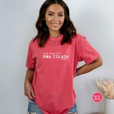 Get ready to be OBSESSED with your new Pina Colada shirt. It's the cutest and most trendy way to emit all those vacation vibes! This is the perfect cocktail tshirt! Great as a gift! * Q U I C K * F A C T S * ✺ 100% preshrunk cotton ✺ Wash and dry normally inside out (on cool for best results) * S I Z I N G * ✺Comfort Colors C1717 ✺ Sizing is unisex so runs like men's, though not overly large ✺ Most women find their typical size works best, since they are meant to fit a touch loose ✺ See size guide in photos for more info * S H I P P I N G * T I M E S * ✺ Our items are individually made with love for each of our buyers. Because of this, our processing time is 2-5 business days (depending on order volume) plus transit time, but typically much faster. We know our customers want their items as Pink Funny Text T-shirt For Summer, Pink Slogan T-shirt For Loungewear, Pink Fun Top With Text Print, Cute Spring Holiday Tops, Pink Short Sleeve Shirt For Loungewear, Cute Holiday Tops For Spring, Cute Tops For Spring Holiday, Casual Short Sleeve Shirt For Holiday, Pink Graphic Tee With Funny Text