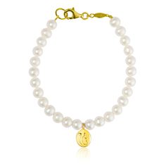 A bracelet of cream freshwater cultured pearls and 18K Gold vermeil charm with adorned sacred Ik OanKar symbol on both sides in silver. Meaning "one divine creator". This is a hand finished piece. Excellent quality cream pearls that are just classic, they compliment everything you wear from morning until evening. Pearls signify honesty, wisdom and most of all purity as our spiritual transformation unfolds. Comes beautifully Gift Wrapped Materials & Size Cream 5mm freshwater cultured pearl bracel Cultured Pearl Bracelet, Universal Love, Spiritual Transformation, Love Bracelet, Intelligent Design, Pearl Cream, Freshwater Cultured Pearls, Love Bracelets, Sterling Silver Charm